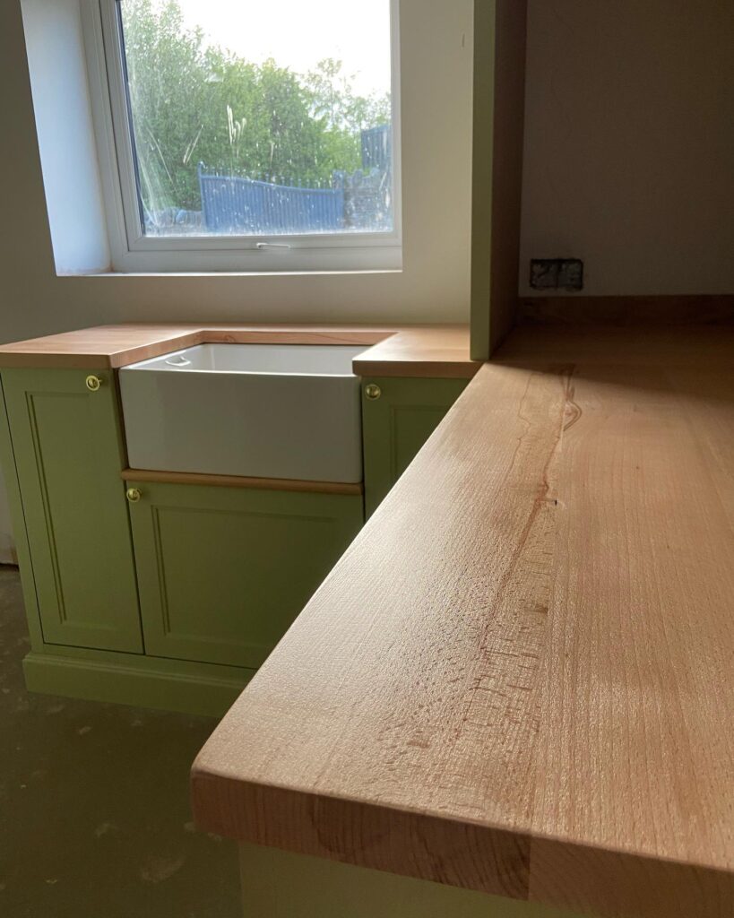 Green bespoke kitchen cabinets in cwmbran